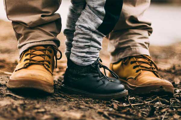 Father and son wearing boots