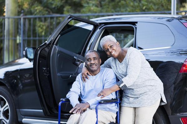 women smiling and man in wheel chair