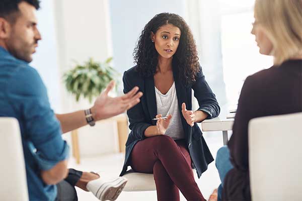 Arguing couple meeting with a mediator