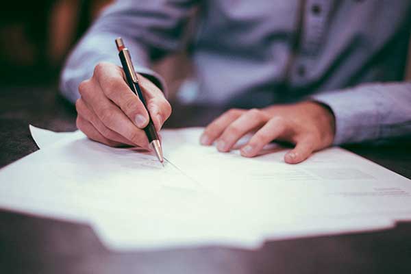 Man filling out paperwork