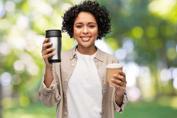 Woman holding coffee cups