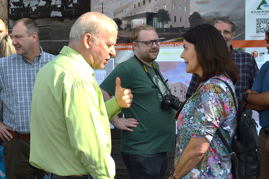 Commissioners Savas and Helm talking