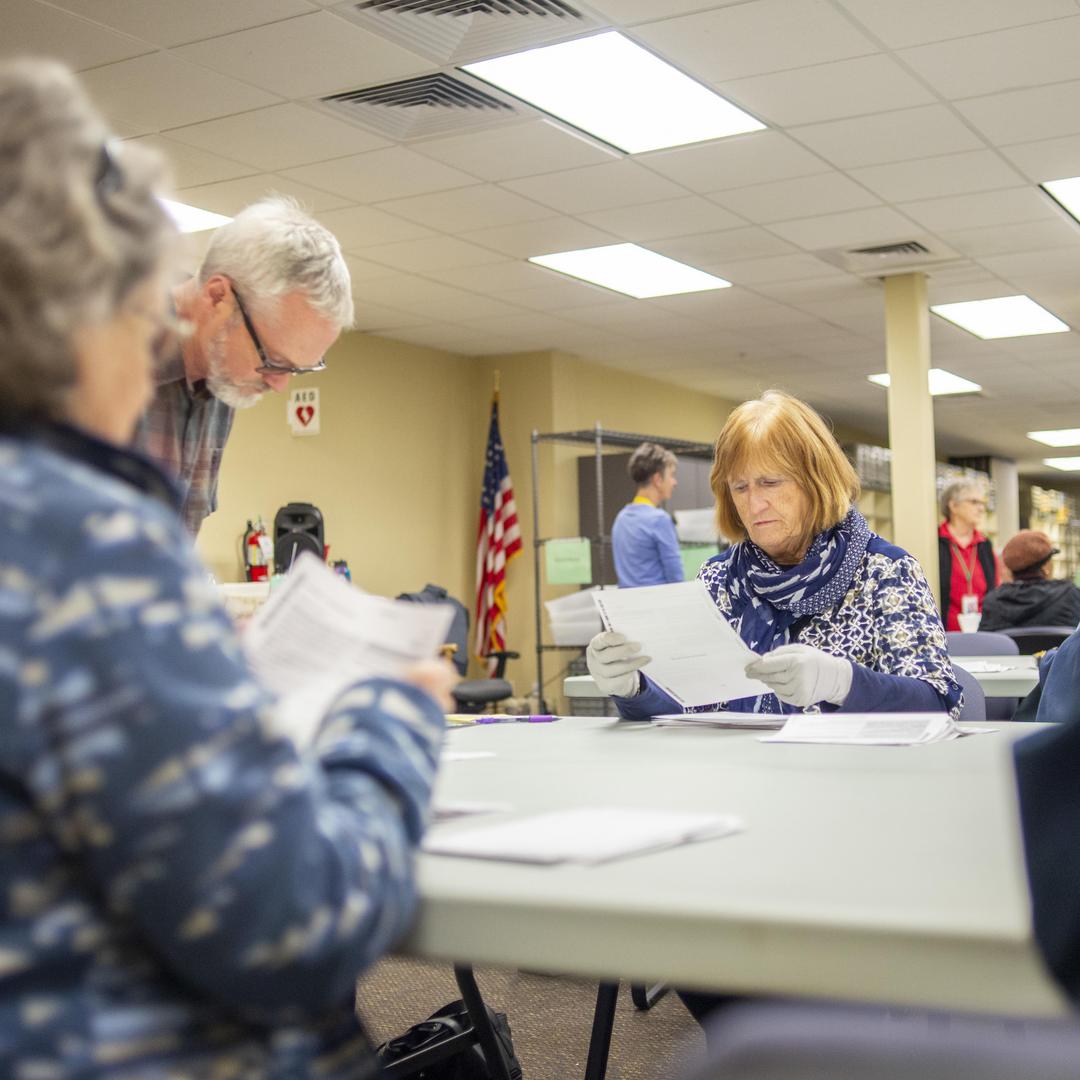 Election workers process ballots on election day.