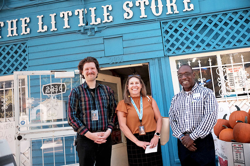 People standing outside the Little Blue Store