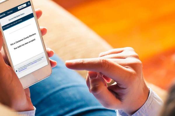 A Voter tracks their ballot on their mobile device.