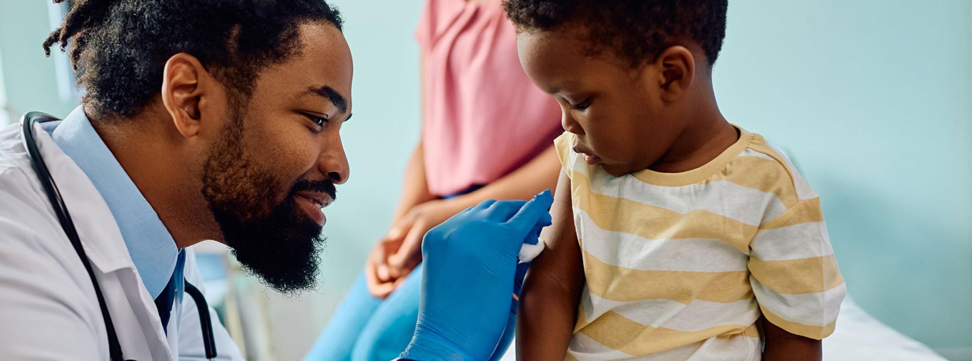 doctor giving child a vaccination