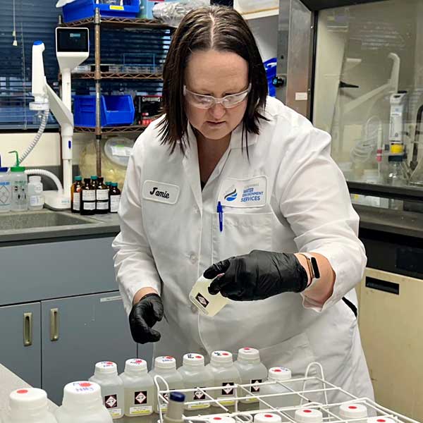 Scientist put samples in her bottle